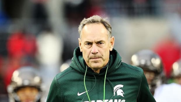 Mark Dantonio takes the field at OSU 2015.  Photo courtesy of Rey Del Rio and the MSU SID